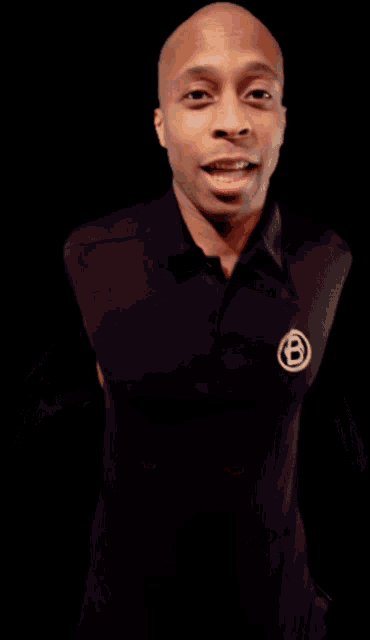 a man with his hands on his head is smiling