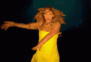 a woman in a yellow dress is dancing against a red background
