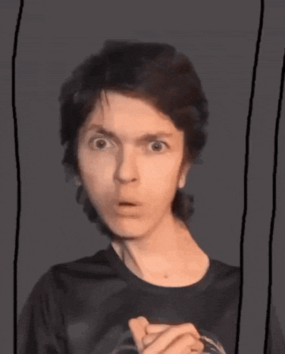 a man with a surprised look on his face is holding something