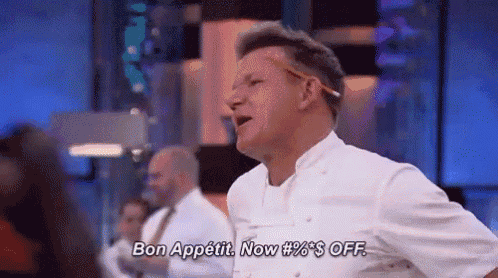 a man in a chef 's uniform is standing on a stage and saying `` bon appetit . now % $ off . ''