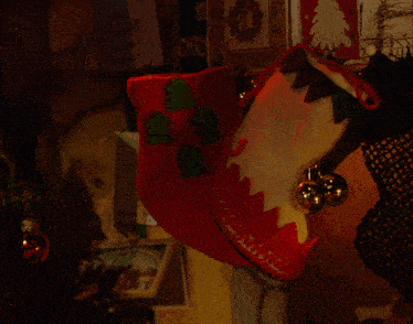 christmas stockings on a mantle with a card that says merry christmas