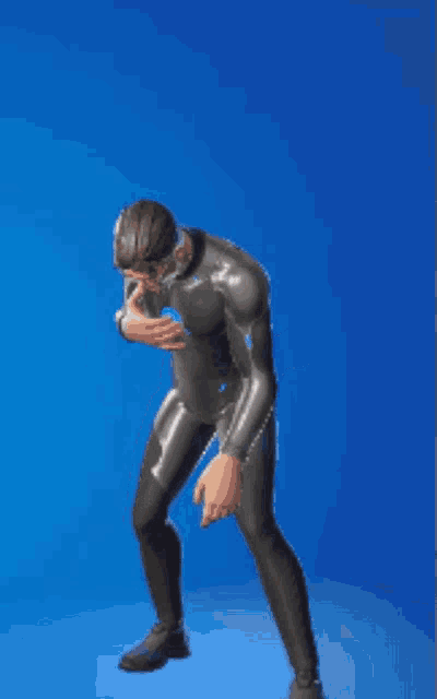 a man in a wetsuit and glasses is dancing in front of a blue background .