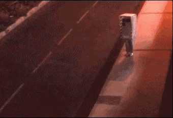 a blurry picture of a person walking down a sidewalk