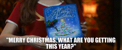 a woman is holding a christmas card that says merry christmas