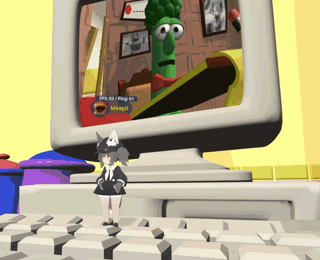 a girl standing in front of a computer monitor that says meapii on the screen