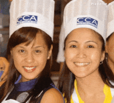 two women wearing chef hats with the letters cca on them