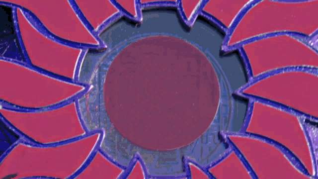 a purple and blue circle with a white center