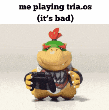 a cartoon character holding a game controller with the words me playing tria.os ( it 's bad )