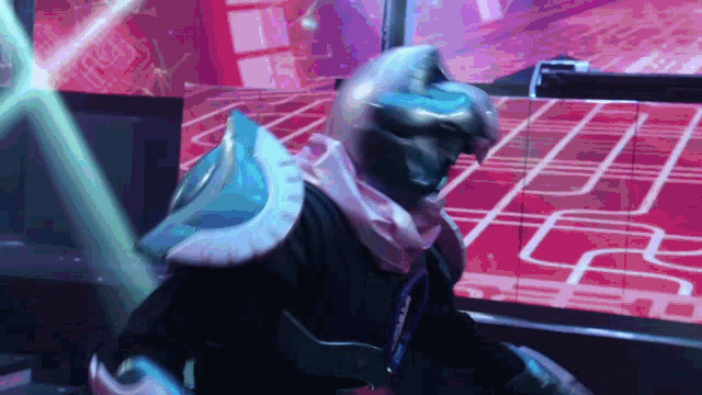 a man in a futuristic costume is standing in a room