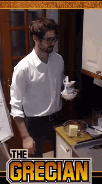 a man in a white shirt is holding a bowl of yogurt in front of a sign that says " the grecian "