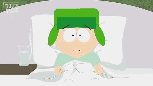 a cartoon character from south park is laying in bed with a glass of water
