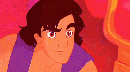 a close up of a cartoon character 's face with a purple shirt and a pink hat .
