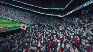 a crowd of people in a stadium with a banner that says ' soccer '