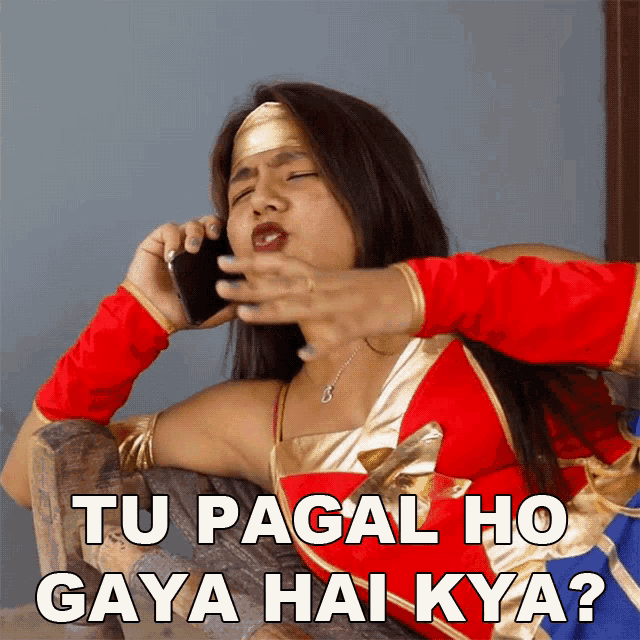 a woman in a wonder woman costume is talking on a phone