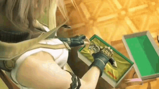 a woman is sitting at a table holding a green box with a sword in it .