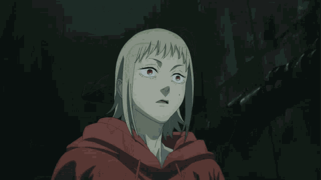 a person holding a knife in front of their face