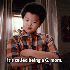 a young boy with his arms crossed says it 's called being a g mom