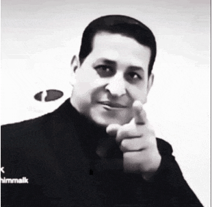 a black and white photo of a man pointing his finger