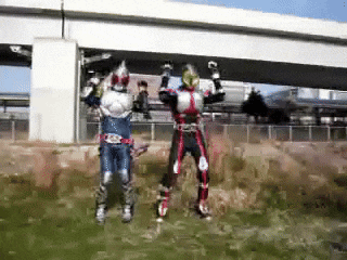 two kamen riders are jumping in the air