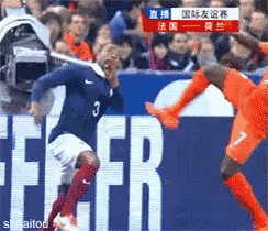 a soccer player with the number 3 on his jersey kicks the ball