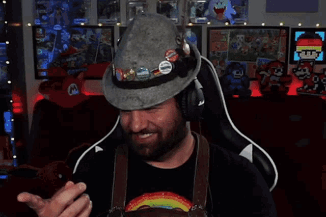 a man with a beard wearing a hat with buttons on it