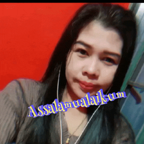 a woman is wearing ear buds and has the words assalamualaikum written on her face
