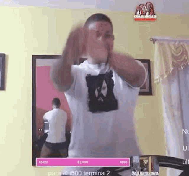 a man is dancing on a treadmill in front of a mirror .