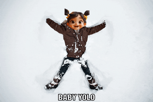a little girl in a brown jacket is making a snow angel with the words baby yolo below her