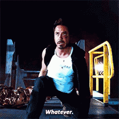 a man in a white tank top is kneeling down and saying whatever