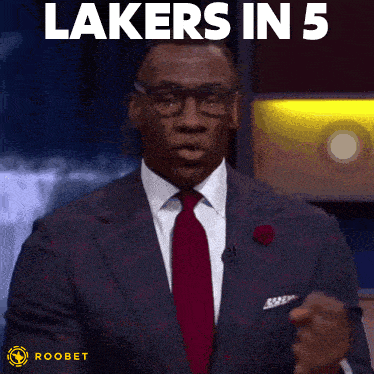 a man in a suit and tie with the words lakers in 5