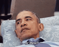 barack obama is laying on a couch with a pillow and says " or these "