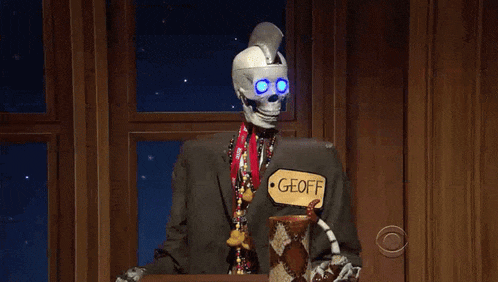 a skeleton with a name tag that says geoff on it