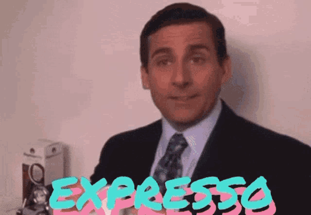 a man in a suit and tie is standing in front of the word expresso