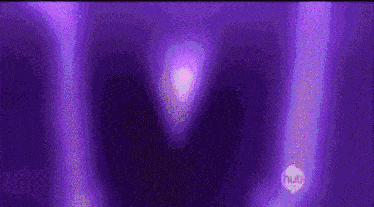 a purple background with a purple glowing object in the middle .