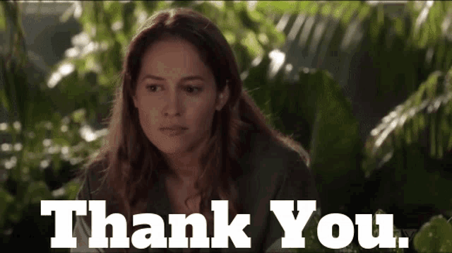 a woman says thank you with a green background