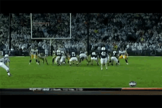 a football game is being played on a field with the abc logo in the background