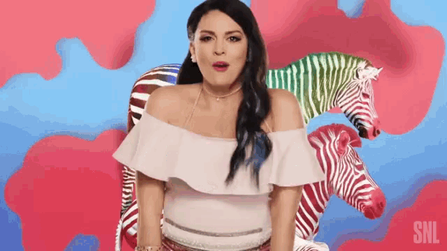 a woman in a white off the shoulder top is surrounded by zebras