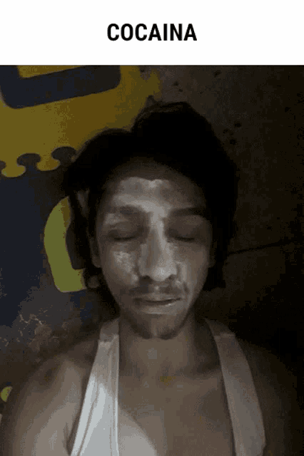 a man with white powder on his face and the word cocaine above him