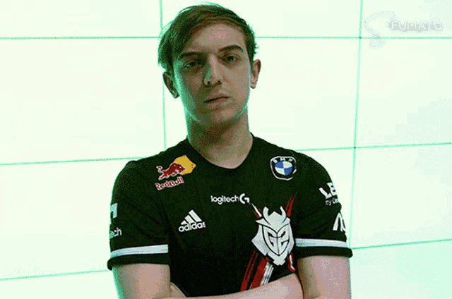 a man with his arms crossed in front of a wall that says dpack