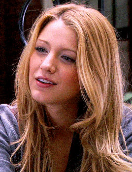 a close up of a woman with long blonde hair