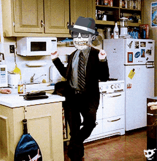 a man in a suit and tie is standing in a kitchen