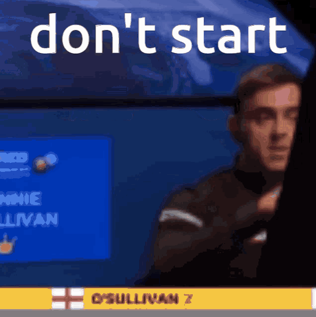 a man is standing in front of a screen that says " don 't start "