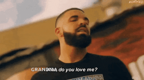 a man with a beard is standing in front of a building and saying `` grandma do you love me '' .