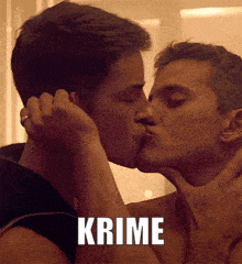 a couple of men kissing with the word crime behind them
