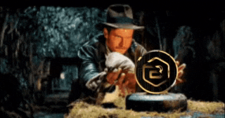 a man in a hat is looking at a coin with the letter r in it