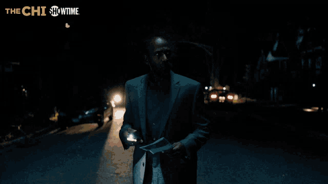 a man in a suit is holding a piece of paper that says kiesha on it