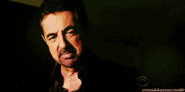 a man with a beard is shown in a dark room with the words criminalobsessions tumblr below him