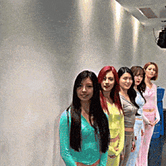 a group of women are posing for a picture together