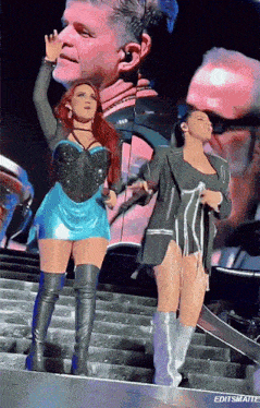 two women standing on a stage with editsmaite written below them