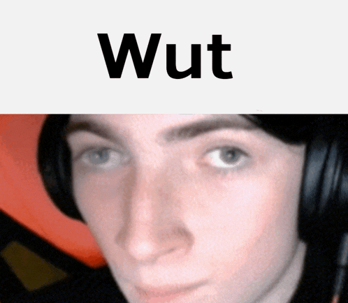 a close up of a person 's face with the word wut written above it